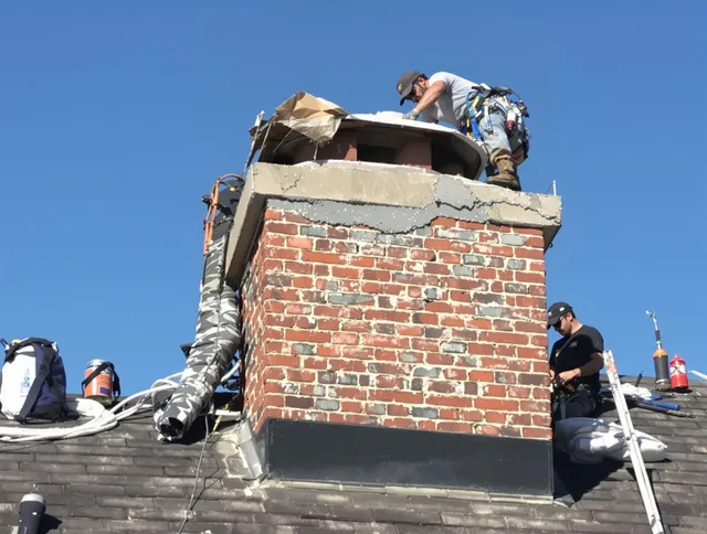 Colorado Springs Chimney Sweep installing a custom chimney crown in Colorado Springs, CO