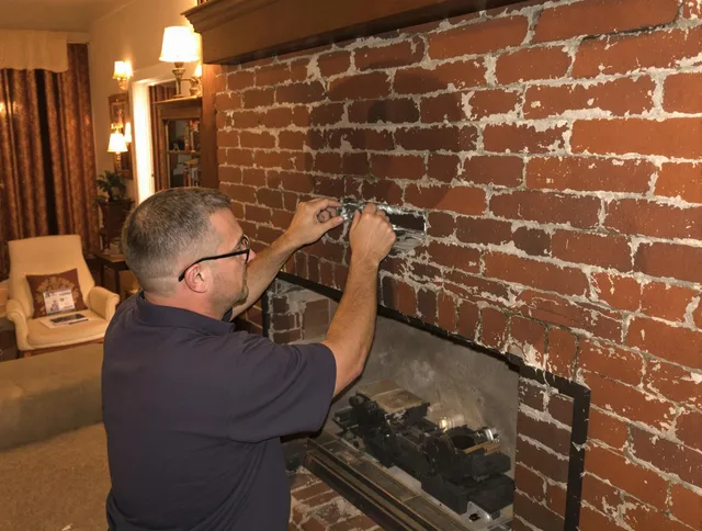 Colorado Springs Chimney Sweep expert fixing a fireplace in Colorado Springs, CO
